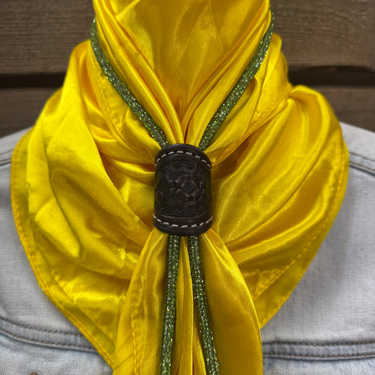 a close up of a yellow scarf on a mannequin